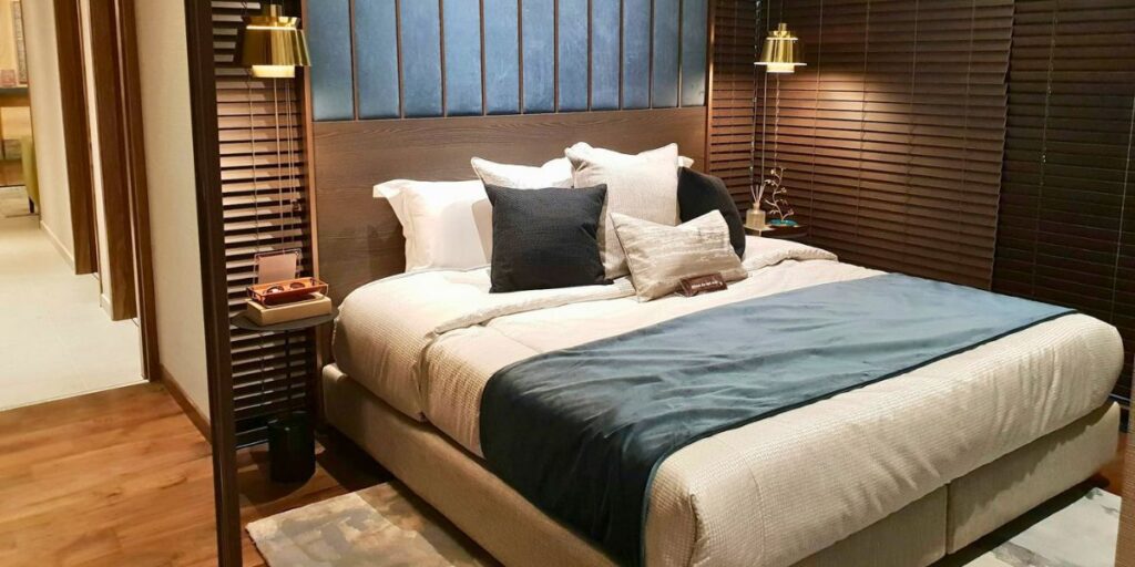 Luxury bedroom managed by a housing agency Liverpool, with modern design and warm lighting.